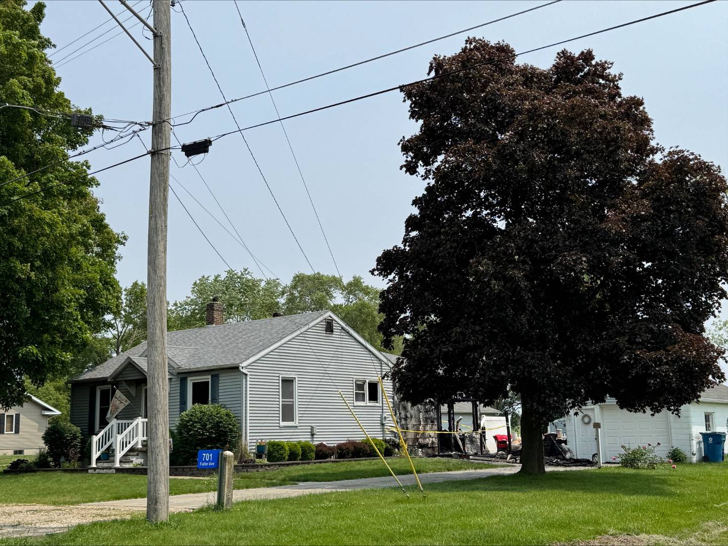 The backside of a home on the 700 block of Fuller Avenue in Streator is taped off Monday, June 2, 2025, following a fire that caused significant damage.