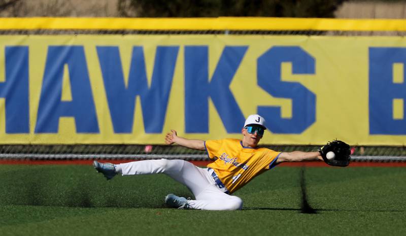 Johnsburg's Brady Fisher threat to come up with a catch during a Kishwaukee River Conference baseball game against Marengo on Wednesday, April 22,2026, at Johnsburg High School.