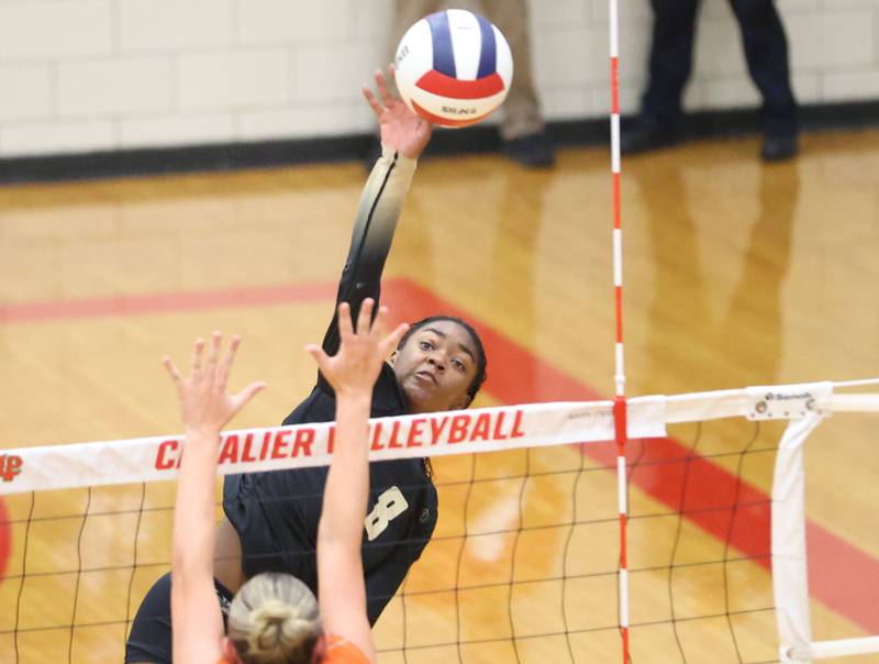 Sycamore's Khiara Thomas sends a spike past Washington during the Class 3A Sectional semifinal game on Tuesday, Nov. 4, 2025 in Sellett Gymnasium at L-P High School.