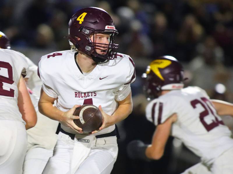 Richmond-Burton’s quarterback Ray Hannemann looks for an option in IHSA football Class 3A second-round playoff action at Bob Stewart Field on the campus of Aurora Central Catholic High School in Aurora on Friday, November 7, 2025.