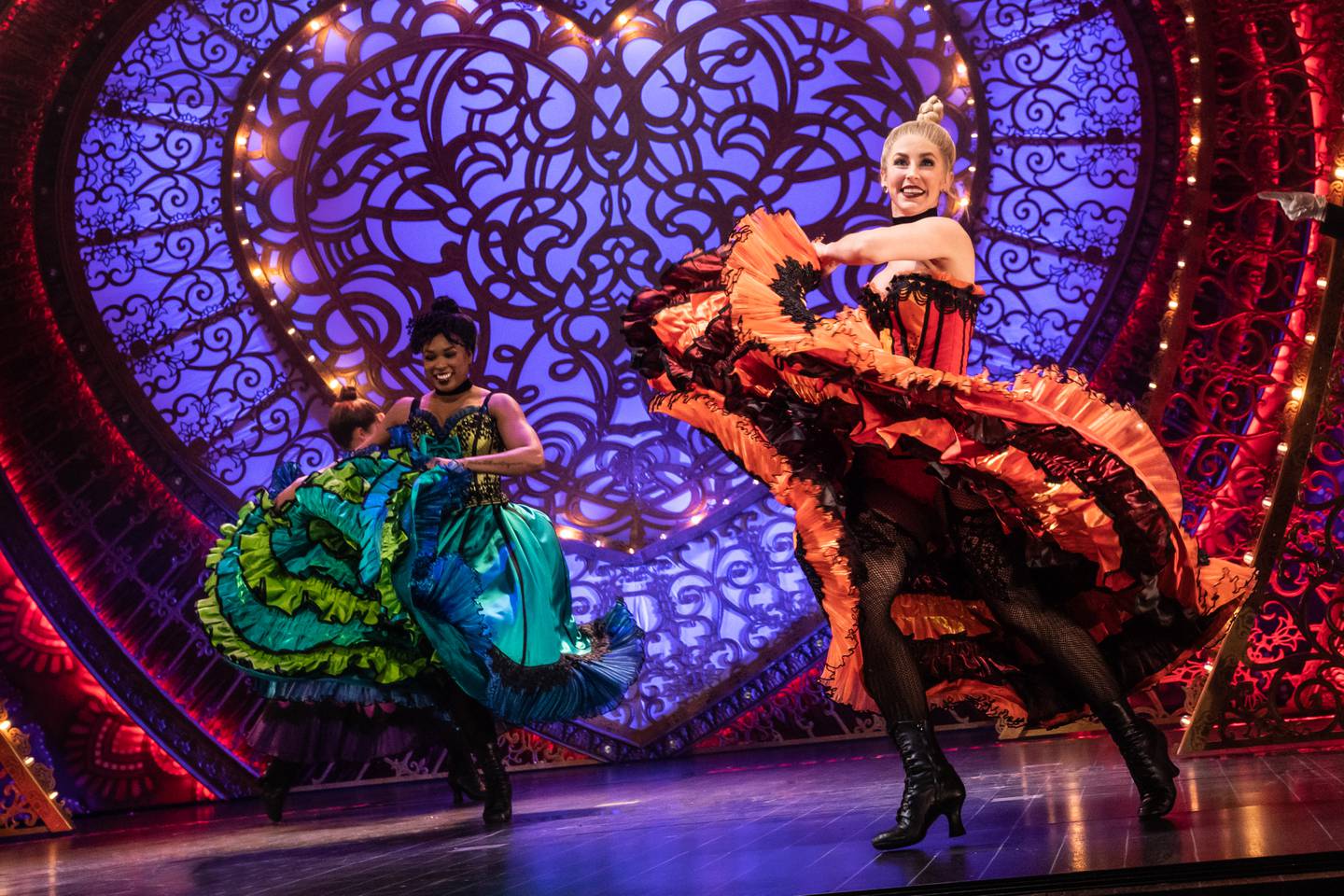 Adea Michelle Sessoms and Jennifer Wolfe, ensemble members in the North American Tour of the Tony Award-winning Best Musical "Moulin Rouge! The Musical," show that they can can-can in the Paris nightspot. "Moulin Rouge" performances run through Sat., May 14 at the James M. Nederlander Theatre, 24 W. Randolph St., Chicago.