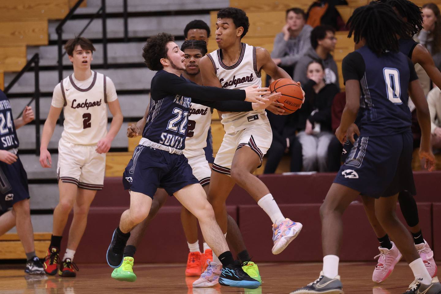 Lockport’s Quinton Hunter fights off Plainfield South’s Jay Pena for the rebound on Wednesday January 25th, 2023.