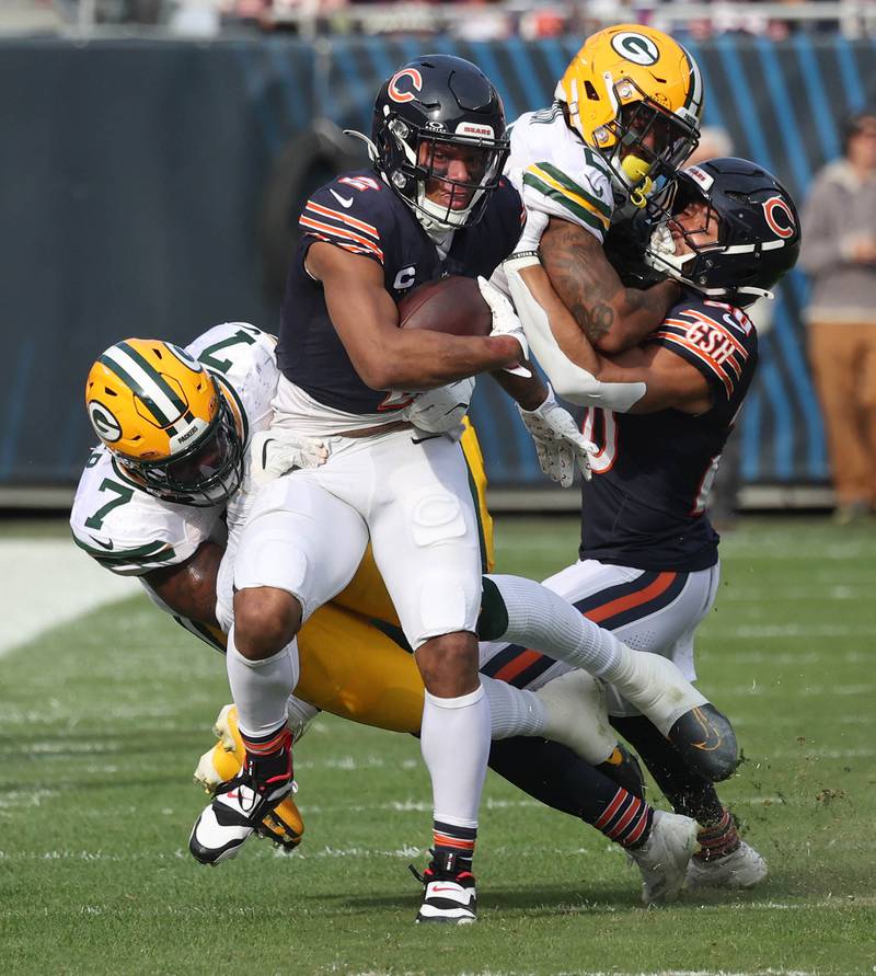 Chicago Bears wide receiver DJ Moore pulls away from Green Bay Packers linebacker Quay Walker Sunday, Nov. 17, 2024, during their game at Soldier Field in Chicago.