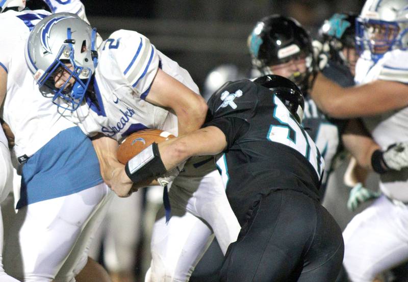 Woodstock’s  Maximus Miller runs the ball in varsity football at Woodstock North Friday night.