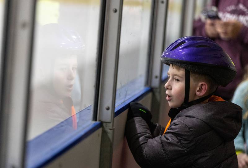 Jack Regner, 6, watches a Zamboni clean and smooth the rink during open skate at Crystal Ice House in Crystal Lake on Friday, Jan. 3, 2025.
