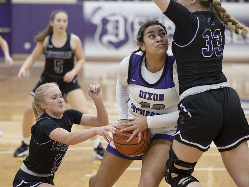 Dixon’s Hallie Williamson works the lane against Rockford Lutheran Friday, Jan. 13, 2023.