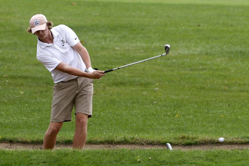 Prairie Ridge’s Tommy Trax hits out of a fairway sand trap on the seventh hole during the Fox Valley Conference Boys Golf Tournament Thursday, Sept. 21, 2023, at McHenry Country Club in McHenry.
