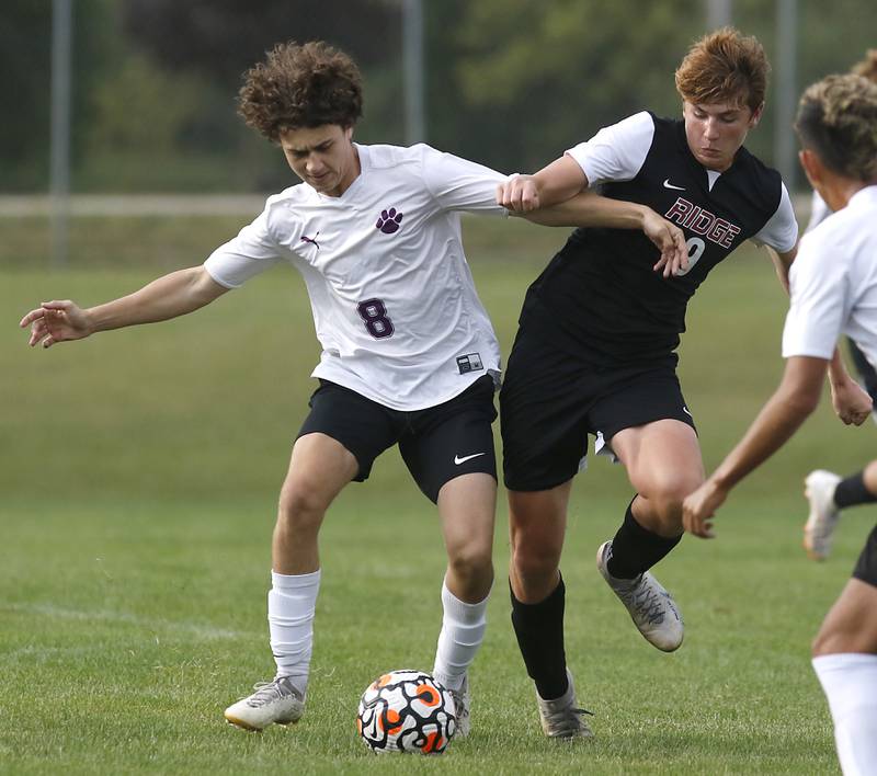 Hampshire's Jakub Prochnicki battles with Prairie Ridge's Matthew Fireng, for the ball during a Fox Valley Conference soccer match Tuesday, Sept. 19, 2023, at Prairie Ridge High School in Crystal Lake.