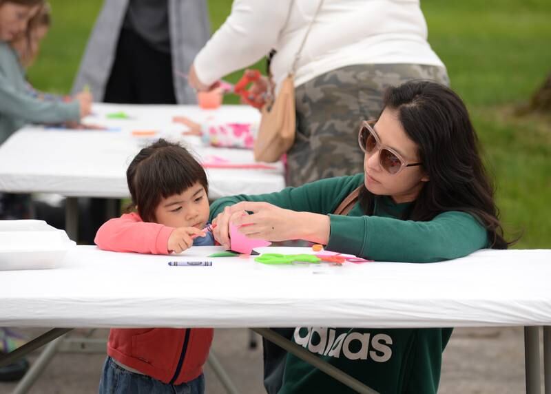 Josephine and Ingrid Oyang of Elk Grove Village work on making a craft together during Cantigny's Spring Fling and Market Saturday May 13, 2023.