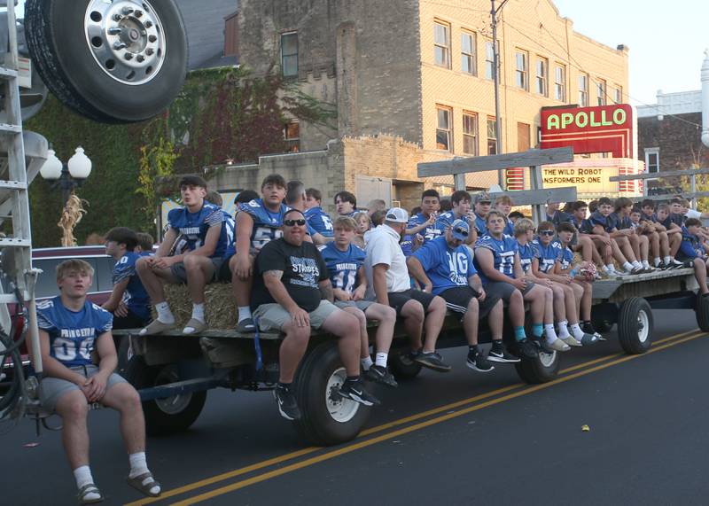 Members of the Princeton High School football team ride a float during the Homecoming parade on Thursday, Oct. 3, 2024 downtown Princeton.