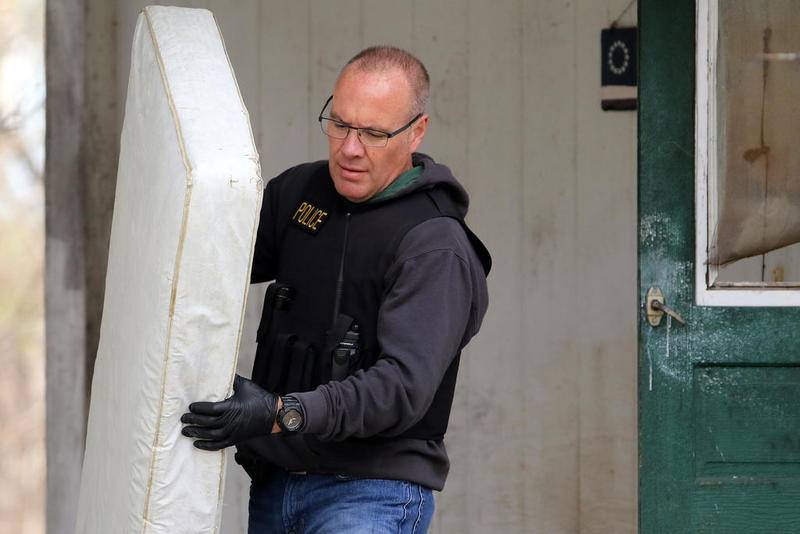 Police collect evidence from the Freund house at 94 Dole Ave on Wednesday, April 24, 2019 in Crystal Lake.