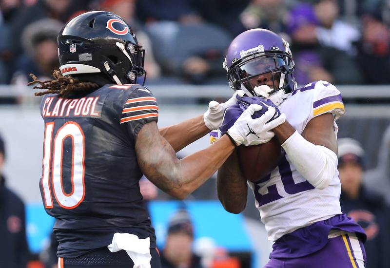 Minnesota Vikings cornerback Duke Shelley intercepts a pass intended for Chicago Bears wide receiver Chase Claypool Sunday, Jan. 8, 2023, during their game at Soldier Field in Chicago.