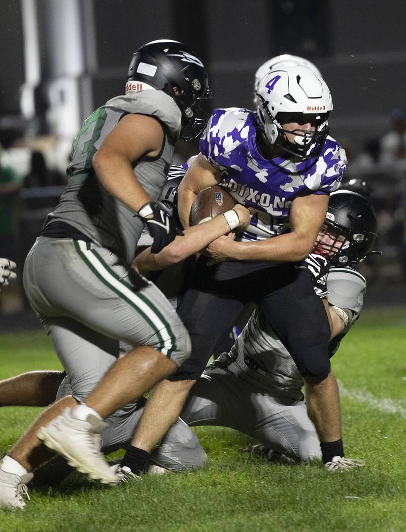 Dixon’s Landon Knigge fights for yards against Rock Falls Friday, Sept. 12, 2025.