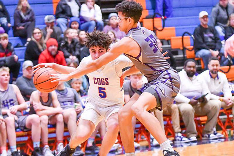Genoa Kingston guard Ryder Easterbrook drives around his defender to the hoop in the first quarter of their game Tuesday, Nov. 28, 2023, against Pecatonica.