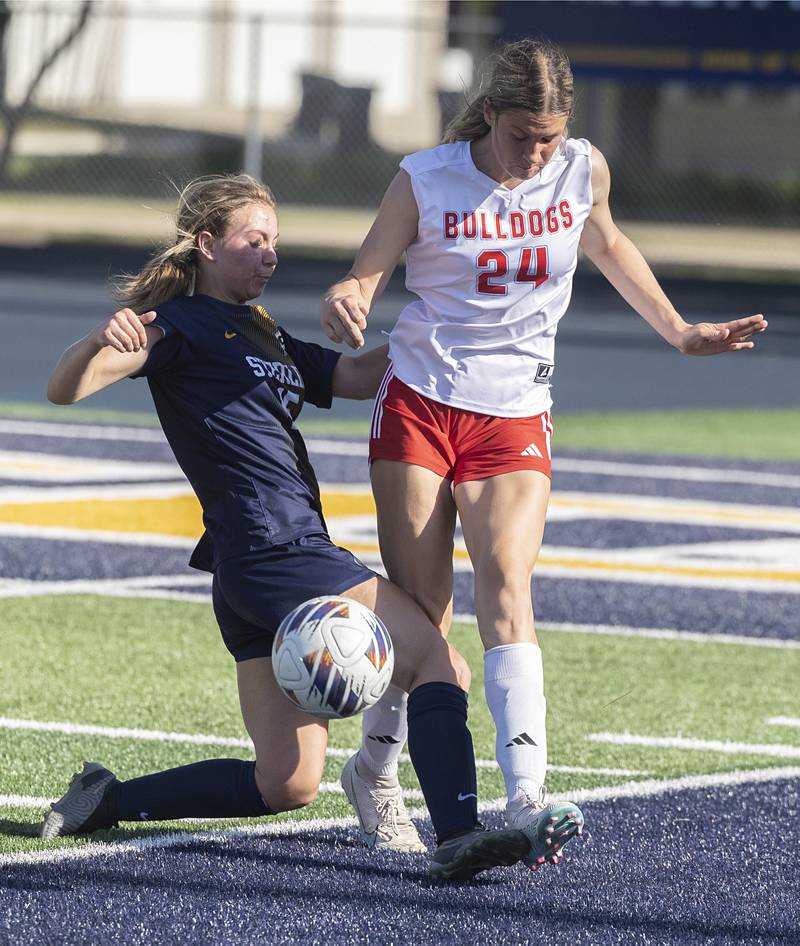 Sterling’s Natalie Scarbrough makes a tackle on Streator’s Rhea Huey Friday, May 15, 2026, during the Class 2A regional soccer quarterfinal.
