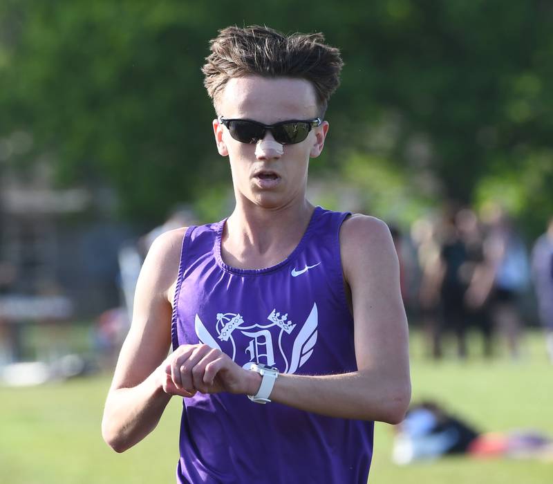 Dixon's Westin Conatser checks his watch for his time as he finishes first in the 3200 meters at the Big Northern Conference Meet at Stillman Valley on Thursday, May 14, 2026.