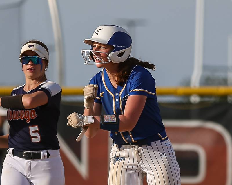 Wheaton North's Monica Kading (9) celebrates at second after hitting a double during Class 4A Plainfield North Sectional final softball game between Wheaton North at Oswego. May 31th, 2024.
