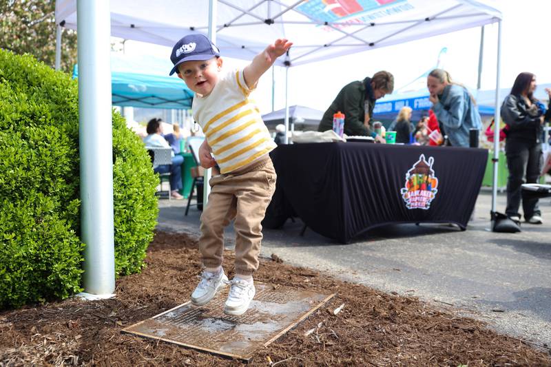 Ryder Blair, 2, of Kankakee, dances to the live music at the first Kankakee Farmers' Market of the year on May 1, 2026.