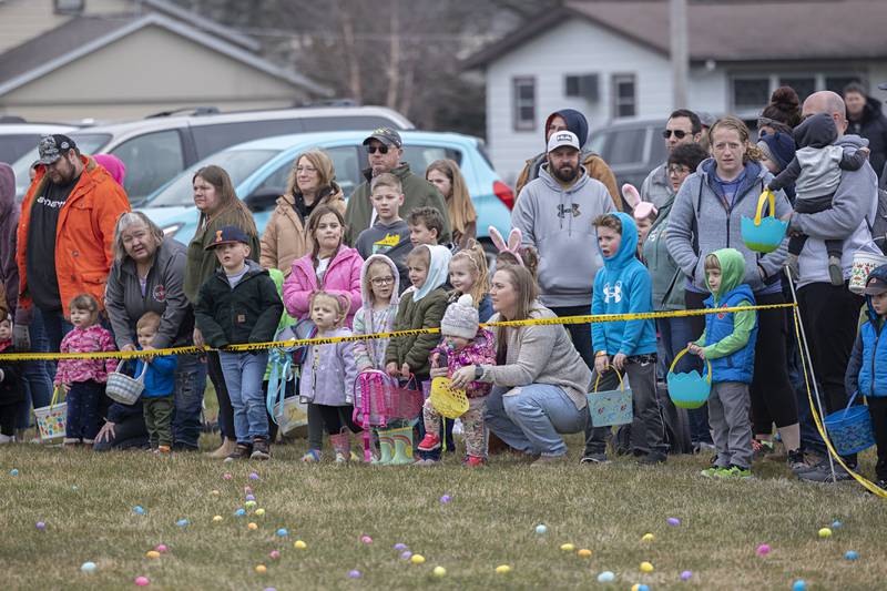 Kids with parents in tow wait to scramble for eggs Saturday, March 30, 2024 during Polo’s egg hunt at Centennial School. Hundreds of kids snatched up thousands of eggs during the scramble.
