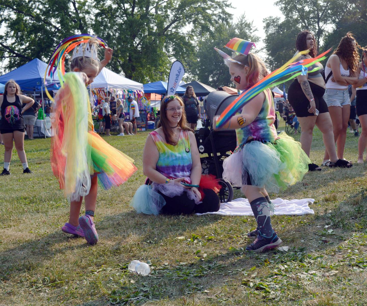 Winnie Tomman, 5, of Sterling, left, and Iris Osenberg, 5, of Dixon, dance with streamers while music plays at the second annual Dixon Pride Fest. The free, family-friendly event took place at Page Park in Dixon on June 17, 2023.
