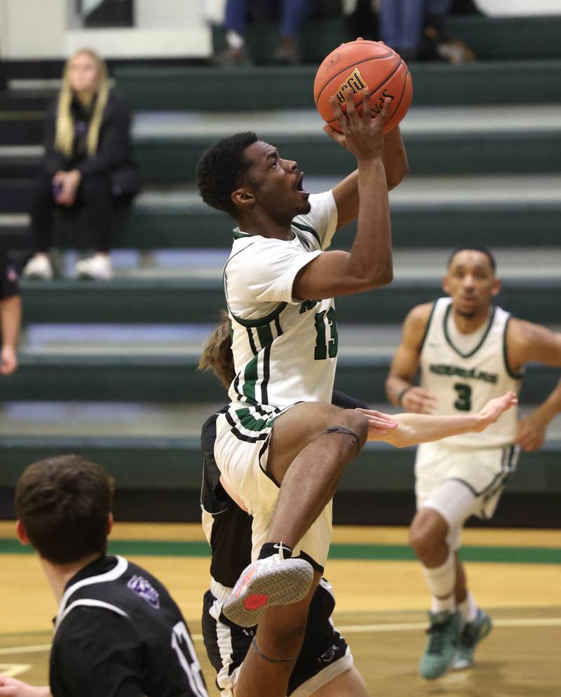 Kishwaukee College's Carron Gibson gets to the basket between two Rockford University defenders Thursday, Jan. 22, 2026, during their game at Kishwaukee College in Malta.