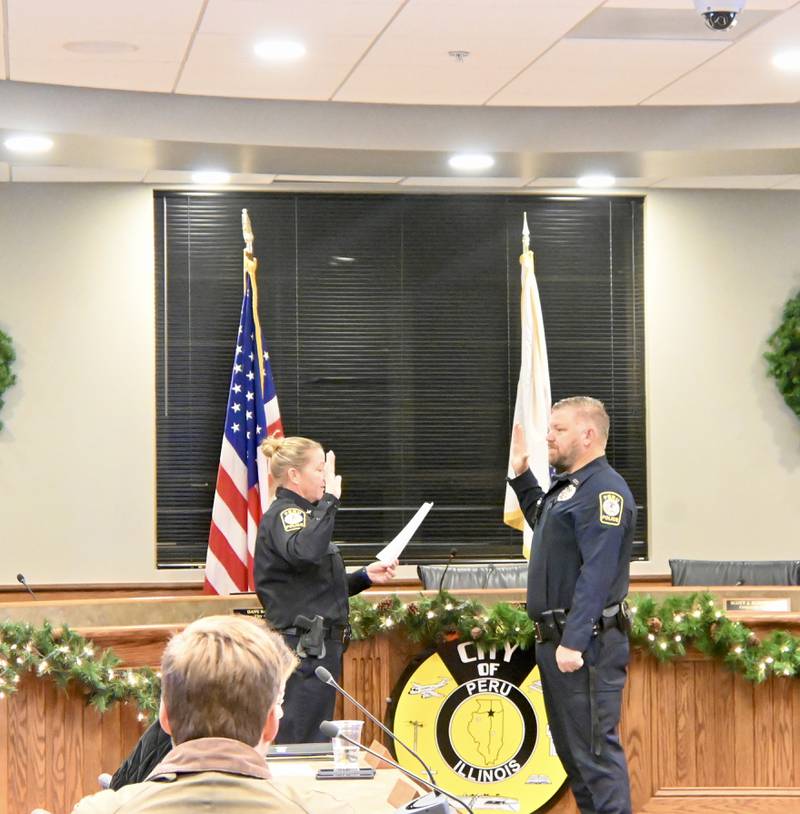 Peru Police Chief Sarah Raymond swears in Brian Zebron as a School Resource Officer for the Peru Police Department during Monday night’s city council meeting.