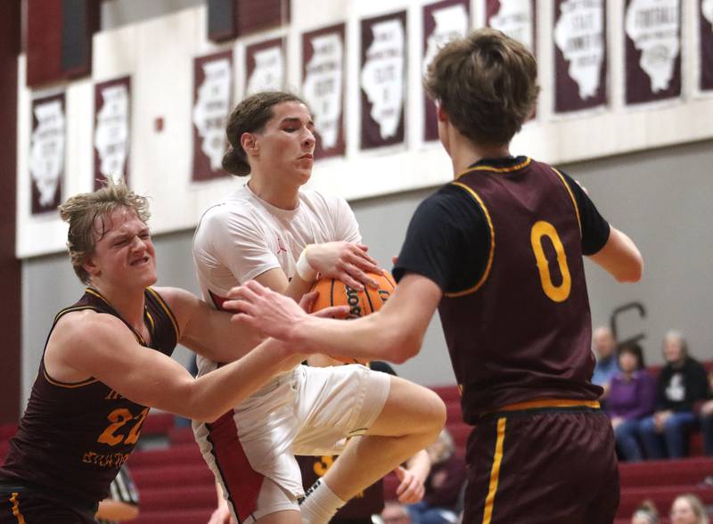 Richmond-Burton’s Ryan Wisniewski, left, tussles with Stillman Valley’s Evan Eddy during 74th Annual E.C. Nichols Holiday Classic varsity boys basketball tournament action on Saturday, Dec. 28, 2024 at Marengo High School in Marengo.