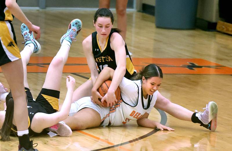 Metea Valley's Caitlin Clish and DeKalb's Ariana Smith fight for a loose ball during their game Thursday, Jan. 19, 2023, at DeKalb High School.