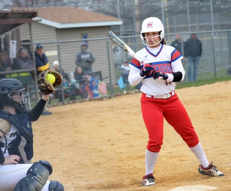 Morrison's Kiyah Wolber watches as Polo catcher Bella Witkowski squeezes a pitch during a Thursday, April 10, 2025 game in Polo.