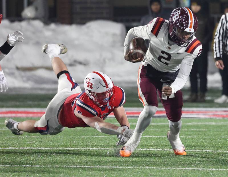 Brother Rice's C.J. Gray breaks free from a St. Rita tackler Wednesday, Dec. 3, 2025, during their IHSA Class 7A state chamionship game in Huskie Stadium at Northern Illinois University in DeKalb.