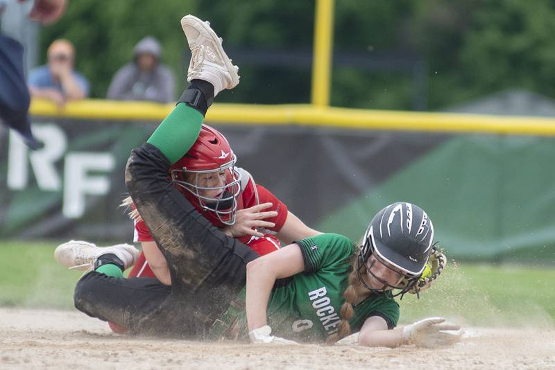Rock Falls’ Rylee Johnson is tagged by Oregon’s Elizabeth Mois out after getting into a run down Friday, May 20, 2022.