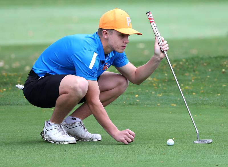 Genoa-Kingston’s Landen Ritchie lines up a putt on the third hole Wednesday, Sept. 27, 2023, during the Class 2A boys golf regional at Sycamore Golf Club.