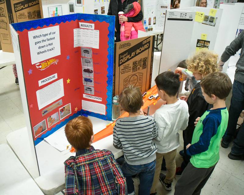 Young scientists play with one of the science project during the District 58 science fair held at O’Neill Middle School in Downers Grove on Saturday Jan. 20, 2024.