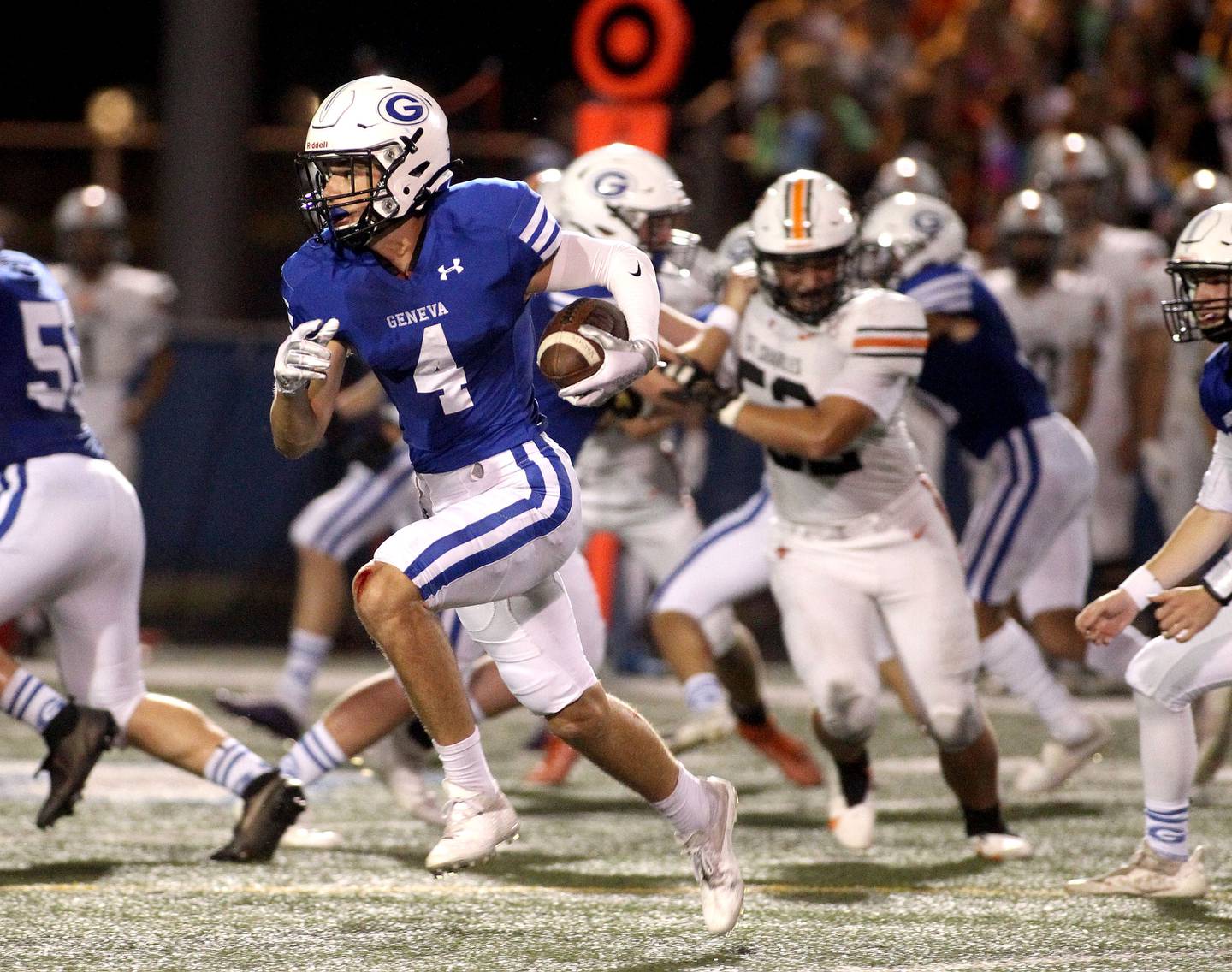 Geneva's Mason Pawelko (4) runs the ball during a home game against St. Charles East on Friday, Oct. 1, 2021.