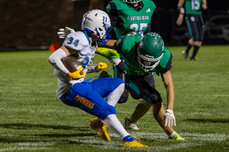 Kyle Stanislo of Aurora Central Catholic gets chased down by Gunner Varland of Seneca on Friday, September 27, 2024 at Seneca High School in Seneca.