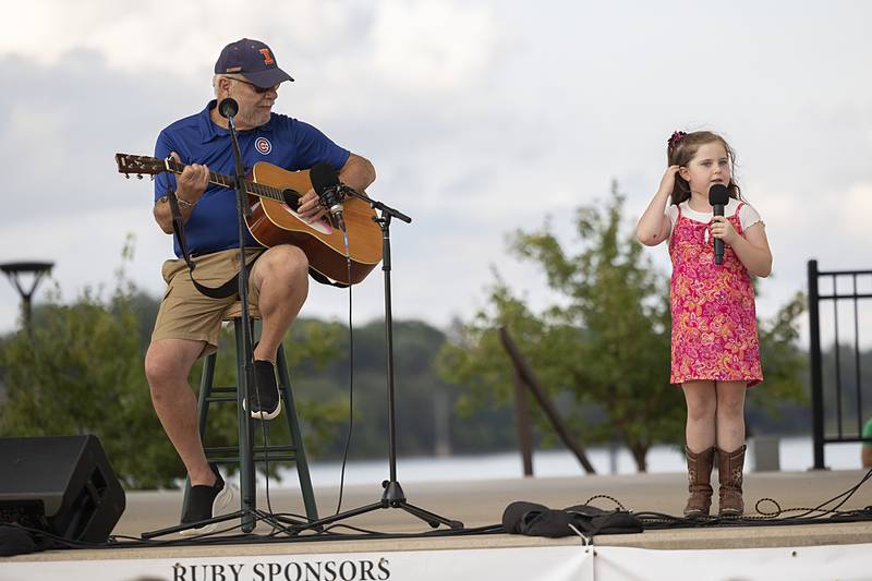 Dennis Rockwell and granddaughter Ella Hollowell, 6, known as Pops and Pinkie, sing Leonard Cohen’s “Hallelujah” on Thursday, Aug. 9, 2024, in the finals of Rock Falls Tourism’s Sauk Valley Talent Competition.