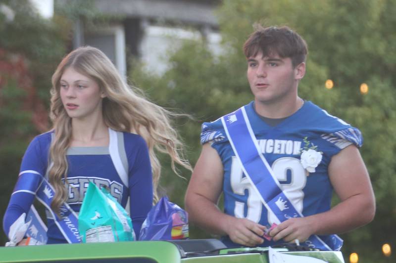 Senior court attendants Caroline Keutzer and Rhett Pearson ride during the Princeton High School homecoming parade on Thursday, Sept. 25, 2025 along South Main Street in Princeton .