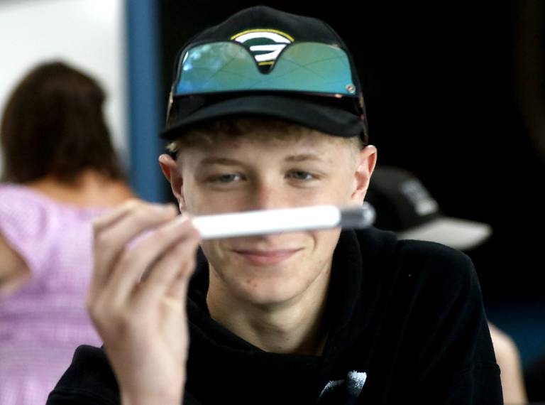 Jackson White, 14,  looks at sugar in a test tube Monday, July 11, 2022, as he takes a health "get-ahead" course during summer school at McHenry Community High School, 4716 W. Crystal Lake Road, in McHenry.