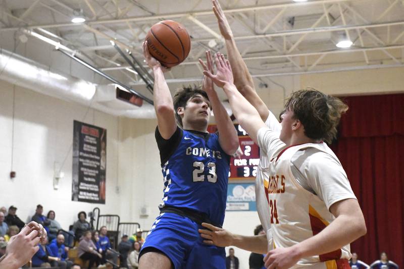 Clifton Central's Mason Mitchell goes up for a shot while contested by St. Anne's Trevor Van Pelt and Jason Bleyle during St. Anne's 61-56 victory over Clifton Central on Tuesday January 6, 2026.