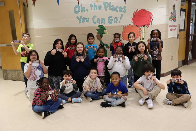 Pictured are Golden Ticket winners from Pershing Elementary School in Joliet Public Schools District 86. Students are reading "Charlie and the Chocolate Factory" for the District 86 2025 One District, One Book reading campaign.