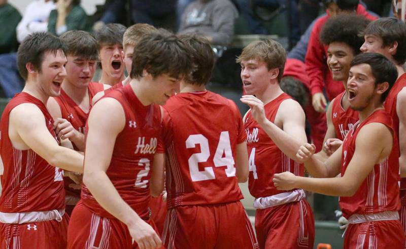 Members of the Hall basketball team congratulate each other after defeating St. Bede on Monday, Dec. 14, 2022 at St. Bede Academy.