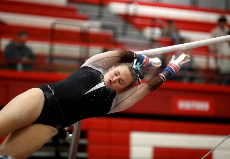Lincoln-Way East’s Rylee Miller competes on the uneven bars during the Hinsdale Central Sectional on Monday, Feb. 10, 2025 in Hinsdale.