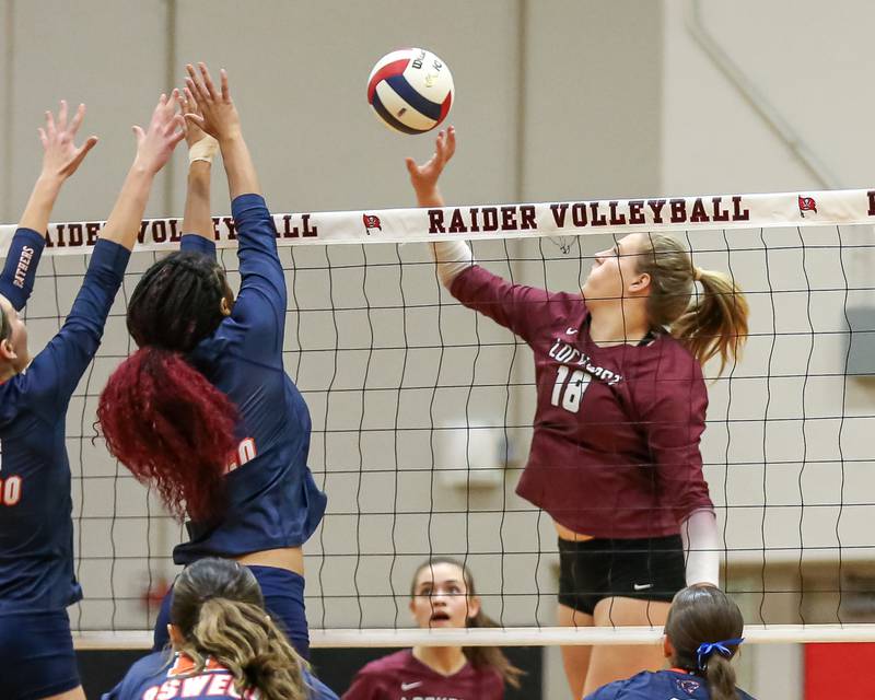 Lockport's Jenna Kolosta (18) taps the ball over the net during Class 4A Bolingbrook Sectional final match between Lockport at Oswego.  Nov 7, 2024  in Bolingbrook.