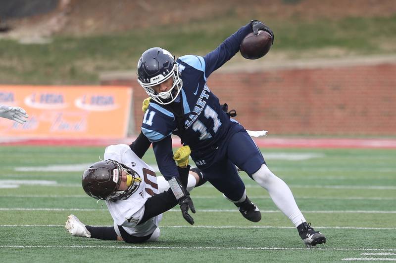 Nazareth’s James Penley stays on his feet after a catch against Joliet Catholic in the Class 5A state championship on Saturday, Nov. 30, 2024 in Normal.
