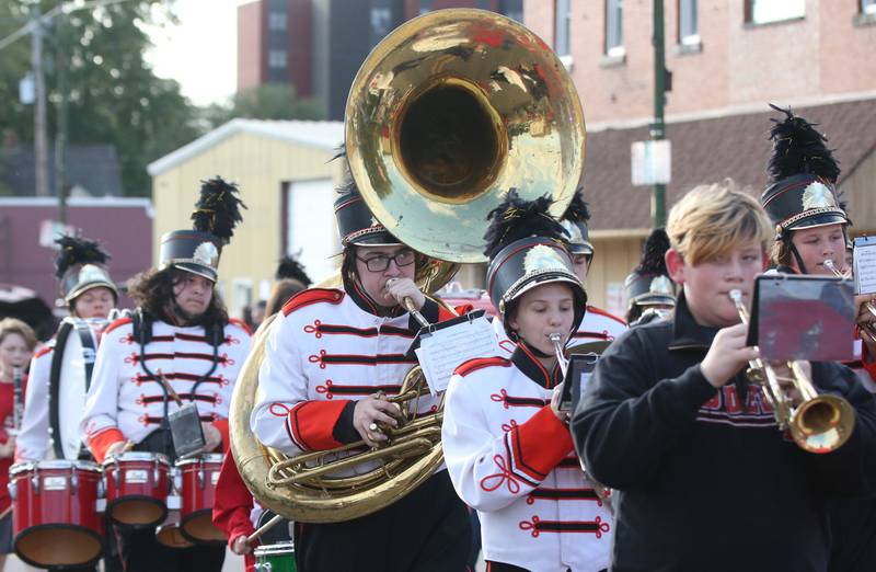 The Hall Marching Red Devils band strolls down St. Paul Street during the Hall High School Homecoming parade on Thursday, Sept. 28, 2023 in Spring Valley.