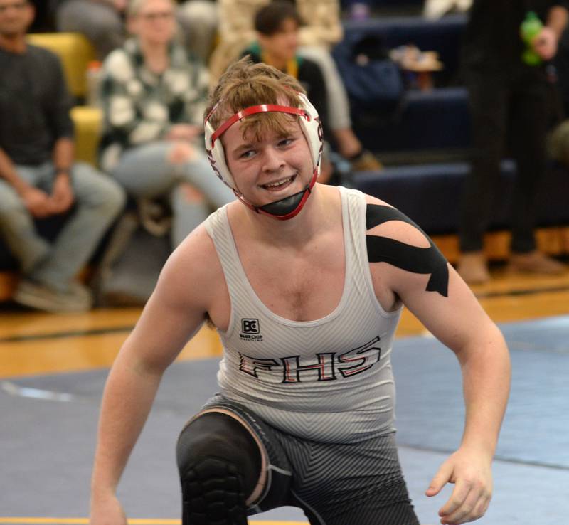 Fulton's Mason Kuebel smiles as he rises from pinning Oregon's Andrew Young in the 175-pound title bout at the Polo Wrestling Invitational on Saturday, Jan. 11, 2025 at Polo High School.