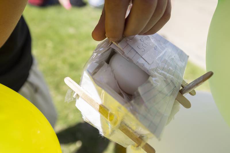 Lincoln fifth grader Dylan Johnson shows the intact egg Friday, May 16, 2025, after his team’s egg drop.