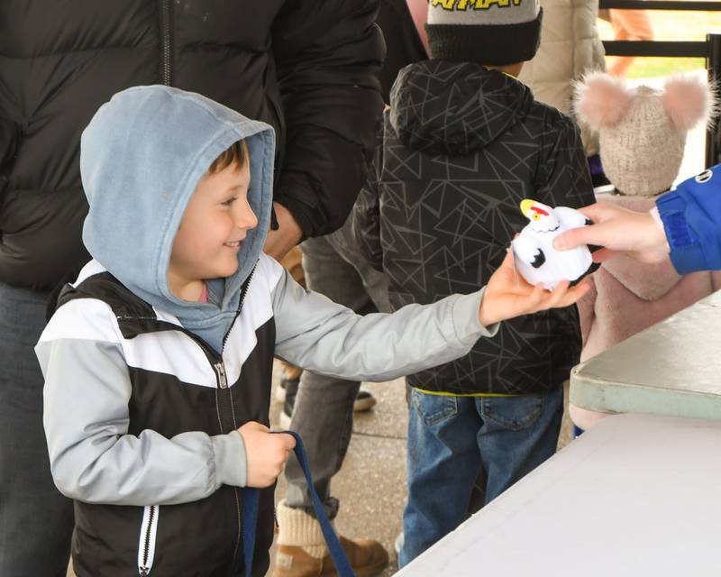 Noah Esche, 5, of Glen Ellyn received his prize after dropping off his Easter Eggs he found during the Easter Egg Hunt event held at Cantigny Park on Sunday March 24, 2024.