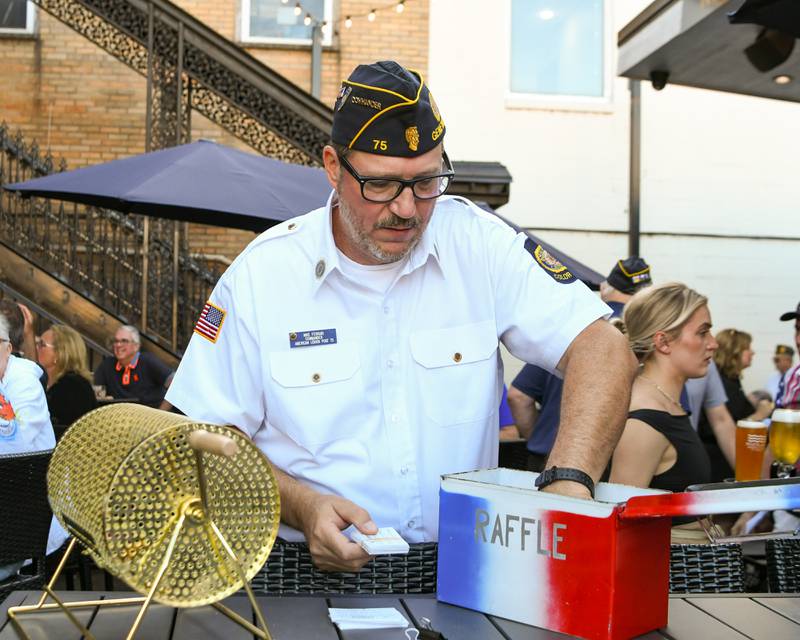Mike Ferrari, commander of the Geneva American Legion post, collects all the 50/50 raffles Thursday Aug. 21, 2025, held at Whiskey Bend in Geneva.