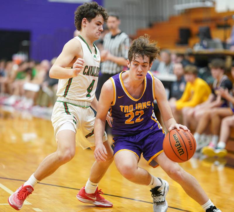 Mendota’s Aden Tillman (22) drives to the hoop against LaSalle-Peru's Jack Jereb (4) during a first round game in the 60th annual Plano Christmas Basketball Tournament at Plano High School in December 2023.